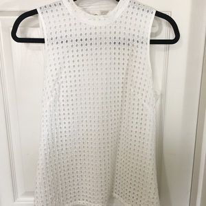 Eyelet sleeveless blouse.